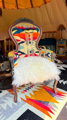 a colorful chair sitting on top of a rug