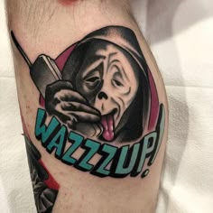 a man's arm with a tattoo on it that reads puzzwa and has a monkey holding a knife