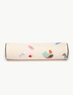 a roll of toilet paper with colorful paint splatters on it