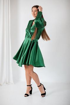 "Feel effortless in our Emerald green mini Silk Dress. Made from a luxurious silk -viscose mix, this dress is designed with a flattering V neckline, button cuffs  sleeves to create a delicate balloon style, this dress is finished with a self tie ballon style sleeves  Collar Style V-Neck Tie Fastening Silk viscose mix  Fabric-65% silk,35 % viscose  Our model wears size S and she is 175cm (5′9″). ✽ All our items are made-to-order, not mass produced. Please choose your sizes and details carefully before you place your order.  Custom size available, with no extra charge. Custom size will be shipped within 1 week and it is not refundable.  * custom sizes and colours are available (see drop-down menu) - if you select \"Custom Size\" option, please send us this information below; Bust- Under-bust Elegant Green A-line Satin Dress, Green Satin A-line Dress, Green Fitted Satin Knee-length Dress, Green Long Sleeve Satin Dress For Party, Green Elegant Satin Dress, Elegant Green Satin Silk Dress, Green Satin Knee-length Dress, Green Knee-length Satin Dress, Green Silk Satin Dress For Formal Occasions