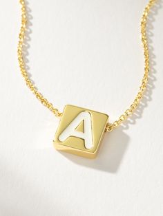 If there’s always an initial necklace in your stack, you need our Bold Letter Necklace. This block letter necklace brings a pop to your stack with its white lettering detail. Layer with our Textured Stud Necklace for a simple, everyday look. For a fully personalized look, shop our Initial Jewelry. | Gold Bold Letter Block Pendant Necklace with Initial A | Women's Jewelry by Uncommon James Trendy White Letter Jewelry, Trendy White Letter Shaped Jewelry, Trendy White Jewelry With Letter Print, Minimalist White Initial Necklace For Personalized Gift, Minimalist White Name Necklace For Personalized Gift, Minimalist White Charm Necklace For Personalized Gift, Minimalist Everyday Letter Beaded Necklaces, Minimalist Everyday Necklaces With Letter Beads, White Monogram Initial Necklace