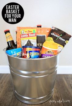 a metal bucket filled with snacks and drinks