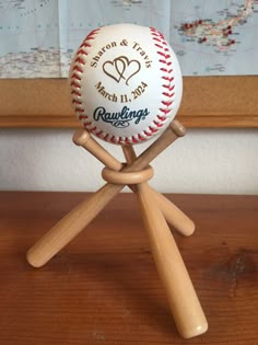 a baseball on a wooden stand with a map in the background