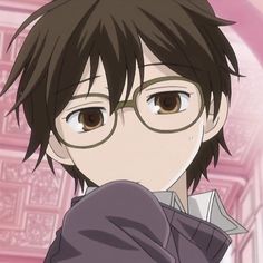 an anime character with glasses looking at the camera