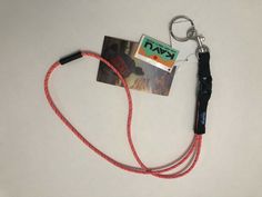 a lanyard with a card attached to it and a key chain hanging from it