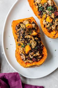 two stuffed sweet potatoes on a white plate