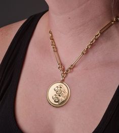 Description Handcrafted in 18K Yellow Gold, this Exuberant Solar/Lunar Strength Medallion, is a bold reminder that Strength is within. We all have it, but sometimes it wanes, and we need to call on it. The lion symbolizes strength, dignity, passion, self-confidence, and solar energy. The tiger represents a quieter, steely strength. It is fierce; soft but powerful, moves with grace and stealth, embodying lunar energy. We all have both solar and lunar energies inside of us. Sometimes it takes grea 22k Yellow Gold Medallion Jewelry, 22k Gold Round Pendant Jewelry Tarnish Resistant, 22k Gold Tarnish Resistant Round Pendant Jewelry, Tarnish Resistant 22k Gold Round Pendant Jewelry, Yellow Gold Pendant Chain Necklace With Coin, Yellow Gold Chain Necklace With Coin Pendant, Yellow Gold Coin Pendant Chain Necklace, Hallmarked Yellow Gold Medallion Pendant Necklace, Hallmarked Yellow Gold Pendant Medallion Necklace