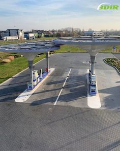 an empty parking lot with solar panels on the roof