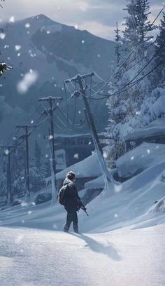 a man standing on top of a snow covered slope next to a ski lift in the mountains