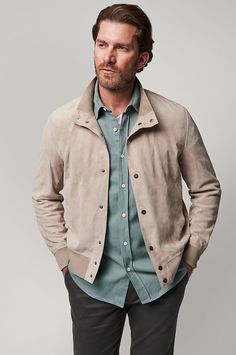 Whether you're hitting the green with friends or packing for a trip to an urban oasis, our Lincoln suede jacket is a perfect companion. This handcrafted, lambskin suede style has sturdy metal snaps and is detailed with tricot knit bands at the cuffs, collar, and hem to help ensure a superior fit. Casual Leather Jacket With Button Cuffs For Fall, Casual Suede Leather Jacket For Winter, Casual Suede Outerwear With Button Closure, Casual Suede Outerwear With Snap Buttons, Casual Suede Leather Jacket With Overlays, Casual Suede Jacket With Suede Overlays, Leather Jacket With Suede Lining, Casual Suede Leather Jacket With Suede Overlays, Spring Suede Outerwear With Button Closure