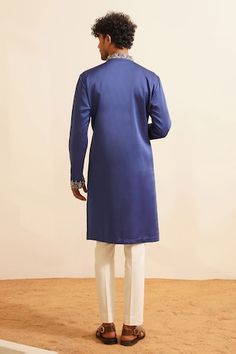 Blue kurta with thread embroidered floral sprig motifs embellished by sequins and pearls. Comes with pant. - Aza Fashions Indigo Kurta With Floral Embroidery For Eid, Indigo Floral Embroidered Kurta For Eid, Traditional Indigo Kurta With Floral Embroidery, Blue Floral Embroidered Sherwani For Eid, Bollywood Style Blue Sherwani With Floral Embroidery, Blue Sherwani With Floral Embroidery, Blue Sherwani With Embroidered Border For Wedding, Festive Blue Sherwani With Embroidered Border, Blue Sherwani With Embroidered Border For Festive Occasions