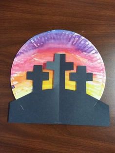 a paper plate with some crosses on it