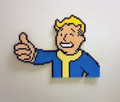 "In Fallout 4, you must become the hero the post-apocalyptic world needs. Click the Add to Cart button now and rescue your family, foiling a mysterious villain's plans to destroy the Commonwealth. Impress your friends and family by owning this awesome Vault Boy sprite. It will definitely start some conversations at your place. Knock back a frosty Nuka-Cola, and then place him in -your- vault at home, say on your locker or fridge. Hang one on your door, or put him on the wall and be the envy of a Fallout 4 Vault Boy, Pixel Art Wall, Perler Pattern, Stitch Bookmark, Nuka Cola, Pip Boy, Crafting Corner, Perler Ideas