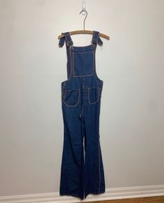 Vintage 1960s homemade overalls. The stitching in the seams is really weird, which is why I think they are home made. Such a sweet cut though. Side buttons. Front pockets, one is coming off but it's an easy repair. They measured out to a size 31 but they look like they fit smaller, like a 28 or so waist. Such an awesome pair of overalls. Waist : 31" Length : 21" Inseam : 32" Retro Bib Front Overalls With Pockets, Retro Overalls With Pockets, Retro Bib Front Denim Jumpsuit, Retro Cotton Denim Jumpsuit With Bib Front, Homemade Overalls, Womens Overalls, Overalls Women, Vintage 1960s, Home Made