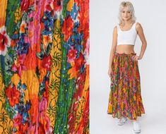 "Vintage 90s broomstick skirt in a colorful floral print. Maxi length with a drawstring waist.  Please see measurements and condition below. Every garment we sell is authentic vintage and one-of-a-kind! You will receive the exact item photographed. Condition: Very good vintage. Best fits: Labelled large Tag: Revue Material:  Labelled Cotton MEASUREMENTS Taken from seam to seam while the garment is lying flat. Double the armpit, waist, and hips For reference, model is 5'8\" and measures 31-23-34. Spring Beach Skirt In Multicolor Print, Spring Beach Skirt With Multicolor Print, Multicolor Print Beach Skirt For Spring, Summer Bohemian Multicolor Print Skirt, Bohemian Multicolor Print Skirt For Summer, Hippie Multicolor Floral Print Skirt, Bohemian Multicolor Print Skirt For Spring, Multicolor Retro Skirt For Vacation, Retro Multicolor Skirt For Vacation