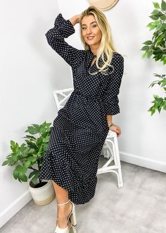 The EMES SHOP dress is detailed with a classic polka dot print. Features a tie neck detail. long sleeves. flowy skirt. ruffle hem. and mid-calf length. Pair it with a handbag and stilettos for a gorgeous look.MATERIAL:100% PolyesterMEASUREMENTS: Product Length 49.5"-51.5"in 4-6-Small | Waist: 25"-26.5"in | Chest: 33"-34.5"in | Hips: 33.5"-35"in 6-8-Medium | Waist: 26.5"-28"in | Chest: 34.5"-36"in | Hips: 35"-36.5"in 8-10-Large | Waist: 28"-29.5"in | Chest: 36"-37.5"in | Hips: 36.5"-38"in 1... Elegant Polka Dot Midi Dress For Spring, Spring Polka Dot Long Sleeve Midi Dress, Spring Long Sleeve Polka Dot Midi Dress, Polka Dot Spring Workwear Dresses, Polka Dot Dresses For Spring Workwear, Polka Dot Work Dresses For Spring, Summer Polka Dot Midi Dress For Work, Polka Dot Midi Length Workwear Dresses, Polka Dot Midi Length Dresses For Work