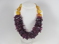 "Chunky amethyst yellow amber necklace,multi strand statement yellow and purple necklace, beaded necklace, big purple yellow beads, fall statement jewelry BEST SELLER Spring 2019 Fashion A bold and dramatic statement necklace featuring acrylic dark amethyst chip beads and big yellow amber beads. 3 strands, light weight. Gold plated lobster clasp Measurements: 19\" (50 cm) plus 3 1/2\" extender Each piece of jewelry from my shop comes beautifully packaged in box and ready for gift giving. Thank y Delicate Wedding Necklace, Big Sister Bracelet, Yellow Marigold, Delicate Silver Necklace, Toddler Bracelet, Dark Amethyst, Long Necklace Boho, Cube Necklace, Real Pearl Necklace