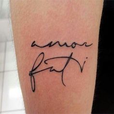 a close up of a person's arm with a tattoo that reads, love faith