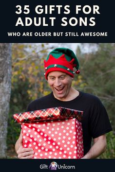 a man holding a christmas present with the words, 35 gifts for adult sons who are older but still awesome