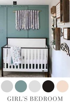 a baby's room with blue walls and white crib in the corner, black and