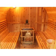 the inside of a wooden sauna with two benches and a heater in it