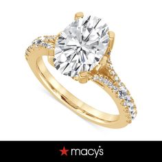 a yellow gold engagement ring with diamonds on it