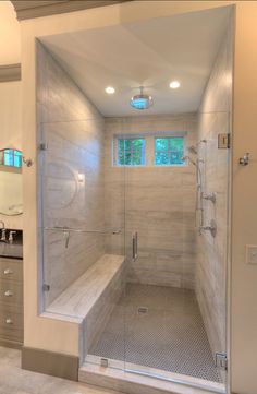 a walk in shower sitting next to a sink