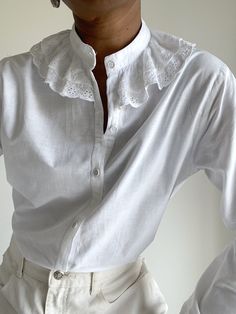 Beautiful cotton button-down blouse with broderie Anglaise trim double collar. * Size/Taille: 10 / 38 UK/EU * Measurements in cm: Shoulder/ Epaules: 40cm Chest (armpit to armpit) / Poitrine (aisselle à l'aisselle): 54cm Length / Longueur-dos: 66cm Sleeve Length / Longueur des Manches: 60cm * Material/ Fabric: Cotton * Condition and Flaws: In good vintage condition. * Washing Instructions: Machine or hand wash This piece is a pre-loved item and comes with its own story. We love it with its irregularities and naturally worn flaws and think its story makes it even more unique. We hope you Love It Too. Fall Cotton Collared Blouse, Fall Cotton Blouse, Fall Cotton Blouse With Collar, Spring Blouse With Detachable Collar For Daywear, Spring Workwear Blouse With Detachable Collar, Spring Collared Blouse With Lace Trim, Cotton Office Shirt, Spring Button-up Blouse With Lace Collar, Cotton Blouse With Detachable Collar