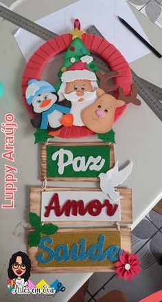 a wooden sign that says pooz, amer, and santa on the front