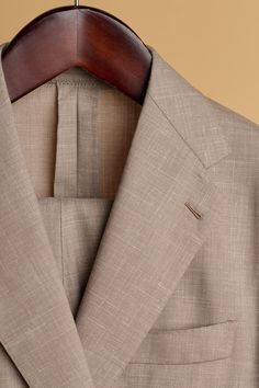 A bespoke suit crafted from a beautiful lighweight "triple-blend" fabric comprised of wool, linen and silk. The wool gives it lasting performance and smooth drape, the linen gives it texture and breathability, and the silk gives it a unique luster with a subtle iridescent sheen unlike any other fabric. Timeless Beige Linen Suit, Fitted Beige Linen Suit, Tailored Beige Linen Suit, Timeless Linen Formal Suits, Beige Linen Suit With Welt Pockets, Beige Linen Suits With Welt Pockets, Timeless Linen Suit For Formal Occasions, Timeless Linen Suit, Timeless Formal Linen Suit