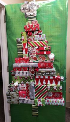 a christmas tree made out of wrapped presents