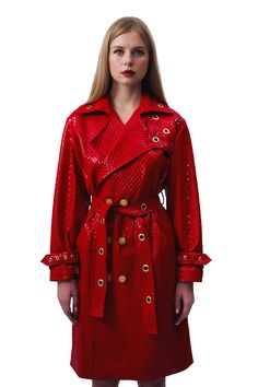 Trinity Trench Coat - Red Key Features: Red polyurethane trench coat Full satin lining Brass grommets Loops and cinch tab at cuffs Cinch Belt Storm Flap Made in the USA Details: Our chic knee-length style, glossy finishes and gold grommet details at the cuff and neckline effortlessly elevates any outfit you’re wearing. With a bold yet subtle accent from our handcrafted, stone buttons with a splash of gold flake. Content + Care: Dry clean only. Size + Fit: Model is wearing a size small. Our Notes Stone Buttons, Cinch Belt, Gold Flake, Red Trench Coat, Gold Flakes, Cherry Red, Trench Coat, Knee Length, Dry Clean