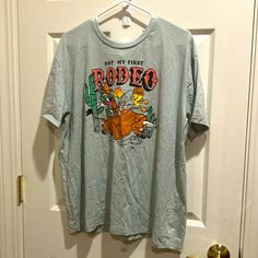 Not My First Rodeo Nwot Light Blue Graphic Tee With Print, Light Blue Fun T-shirt With Graphic Print, Fun Light Blue T-shirt With Graphic Print, Fun Light Blue Crew Neck T-shirt, Fun Light Blue Crew Neck Top, Light Blue Crew Neck Top, Not My First Rodeo, My First Rodeo, First Rodeo