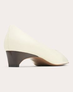 A fresh take on archival NEOUS designs, the Taika pump crafts its pointed-toe profile from genuine calf leather. Wrapped in a contrasting hue, the curved kitten heel delivers sculptural contrast to this slip-on style. Slip-on Pointed toe Sculpted comma heel Upper: 100% calf leather Lining: 100% goat leather Heel: 100% ABS plastic Outsole: 100% cow leather Spot clean Made in Italy Size & Fit Heel height: 1.57in (40mm) Fits true to size Sustainability Metrics: Circular Economy: product is intentio Circular Economy, Goat Leather, Kitten Heel, Leather Pumps, Cow Leather, Leather Heels, Calf Leather, Kitten Heels, Heel Height