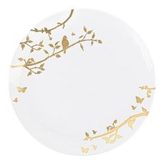 a white plate with gold leaves and birds on it