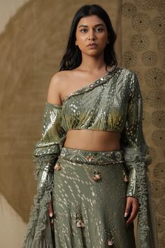 Indian Lehnga in georgette fabric. Comes with dupatta and one shoulder blouse. Perfect for wedding occasions or any semi formal functions. Can be made in any colour and size. Fusion wear perfect for all body types Green Pre-draped Saree With Dupatta For Party, Green Zari Work Sharara For Party, Pista Green Pre-draped Saree With Sheer Dupatta For Party, Green Georgette Party Wear Sets, Pista Green Georgette Pre-draped Saree For Navratri, Fitted Palazzo Set With Gota Work For Party, Fitted Pista Green Palazzo Set For Reception, Wedding Party Wear Pre-draped Saree With Gota Work, Festive Pista Green Pre-draped Saree For Party