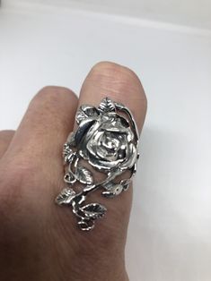 Lovely and delicate Rose flower ring 925 Sterling silver with black rhodium Size 6 or 9 or 10 can be re sized for you on request. My jeweler charges $10 All rings are shipped in a nice gift box. Check out our over a THOUSAND great reviews Engraving is $4 per letter and is not always perfect depending on the piece. It can take a few days if the jeweler is busy. This is payable to Paypal Judithsltd@gmail.com Silver Flower Ring With Rose Design, Silver Flower Ring With Roses For Gift, Silver Rose Design Ring, Silver Ring With Rose Design, Silver Rose Design Jewelry For Promise Ring, Silver Flower-shaped Rings With Rose Design, Elegant Silver Rings With Rose Design, Silver Promise Ring With Roses Detail, Elegant Silver Rings With Rose Details