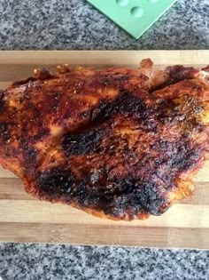 a piece of meat that is sitting on a cutting board