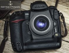 a camera sitting on top of a wooden table