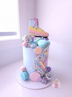 there is a cake made to look like it has shoes on top and other items around it