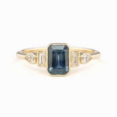 Edith Ring 1.03ct Deep Teal Blue Montana Sapphire, 14k Yellow Gold (One of a kind) Sapphire Art Deco Ring, Unique Sapphire Rings, Rings 2023, Colored Stone Engagement Rings, Ivory Ring, Ring Inspo, Ring Emerald Cut, Blue Diamond Ring, Dainty Gold Rings