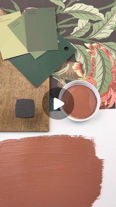 a table with some paint samples and a cup of coffee