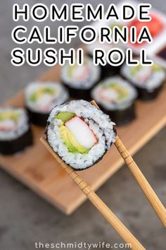 sushi rolls with avocado on top and chopsticks