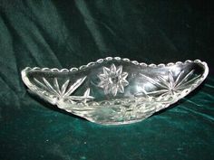 a glass bowl sitting on top of a green table