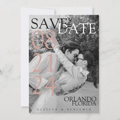 save the date card with an image of two people hugging