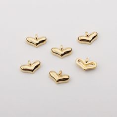 1PCS - Mini Heart Plump Pendant, Tiny Heart Necklaces, Heart Medallion, Plump Heart Charms, Love Pendant, Gold Heart Pendant Material : Brass Measurement : 8.1mm x 5.2mm (closed loops) Color : Gold Plated Quantity : 1 Piece Origin : South Korea Copyright ⓒ Maisonbeadz all right reserved Gold Heart Charms For Valentine's Day, Gold Heart Charm For Valentine's Day, Valentine's Day Heart Beads Charms With Heart Pendant, Valentine's Day Heart Charms Pendant, Valentine's Day Gold Heart Charm, Valentine's Day Heart Charms With Heart Beads, Valentine's Day Heart Charms With Beads, Heart-shaped Charms For Valentine's Day Jewelry Making, Heart Charms For Jewelry Making On Valentine's Day