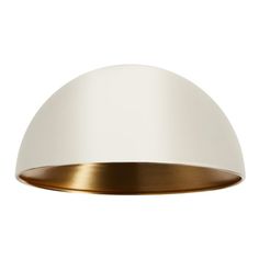 a white and gold ceiling light on a white wall