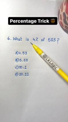 a pen sitting on top of a piece of paper next to a calculator