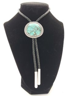 Southwest oldstock (1970's) turquoise Bolo Tie. This is one of my handmade bolos, featuring one of the finest turquoise stones that you are going to see. This beautiful translucent stone is as deep as a pool of water. I saw mountains in it when I oriented the stone. It looks like a landscape to me. 5mm cord with 7mm simple sterling tips. This is an heirloom quality bolo. Stunner. Turquoise Bolo Tie, Georgetown Tx, Amazon River, Bolo Ties, Bolo Tie, Turquoise Stones, Tie Accessories, Suit And Tie, Turquoise Stone