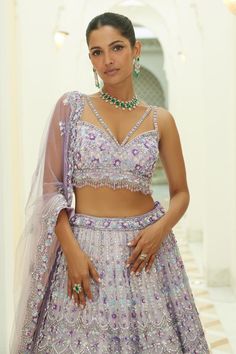 Lilac ombre organza lehenga embroidered in tonal and contrast beads, sequins and crystals in a trellis pattern and attached cancan. Paired with an embroidered padded choli and dupatta.
Components: 3
Pattern: Embroidered
Type Of Work: Sequin, Bead, Crystal
Neckline: Sweetheart
Sleeve Type: Sleeveless
Fabric: Organza, Satin
Color: Purple
Other Details: 
Attached cancan
Padded Blouse
Approx. product weight: 7 - 9 kgs
Lehenga length: 45 inches
Occasion: Wedding, Bride - Aza Fashions Fusion Style Wedding Sets For Festive Occasion, Fusion Style Festive Wedding Sets, Fusion Style Lehenga With Traditional Drape For Wedding, Fusion Style Wedding Lehenga With Cutdana, Festive Fusion Wedding Sets, Fusion Style Sharara For Wedding And Festivals, Fusion Style Wedding Sharara With Dupatta, Festive Fusion Lehenga For Wedding, Festive Fusion Style Wedding Choli